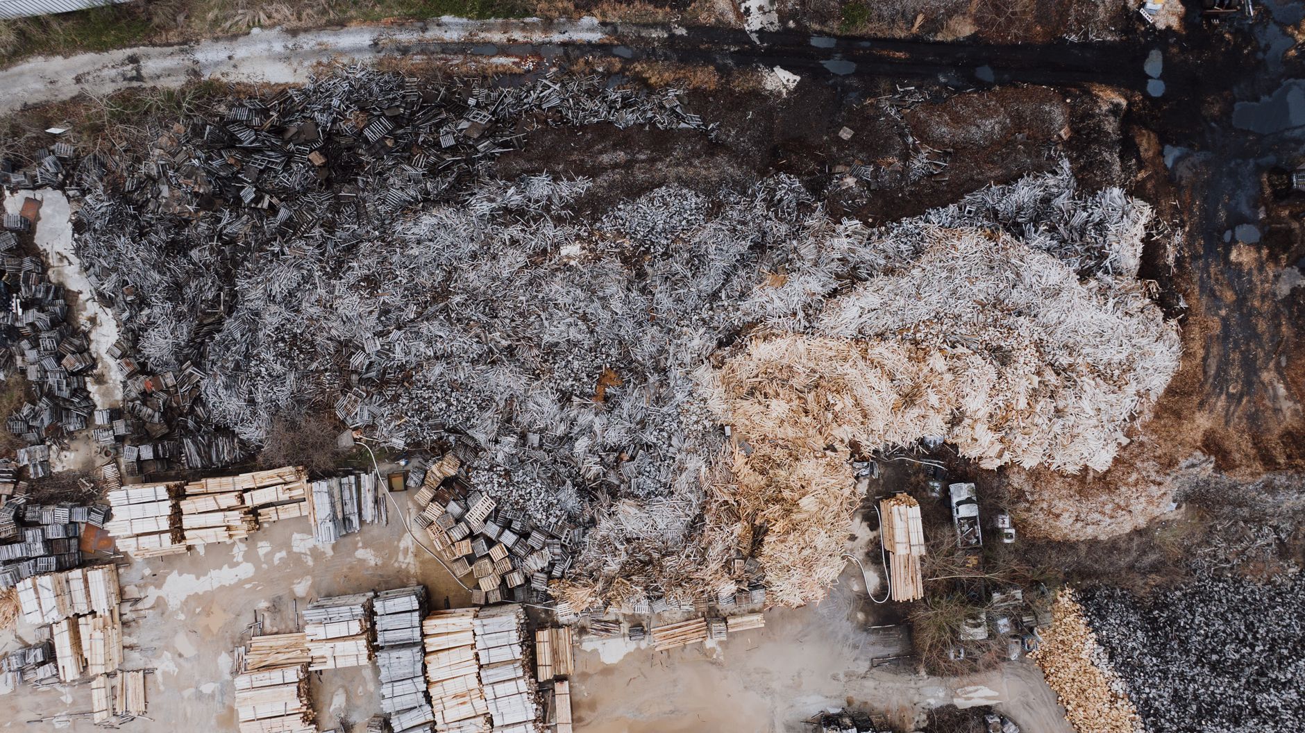 Aerial shot of a lumber yard with timber piles in Chattanooga, Tennessee.