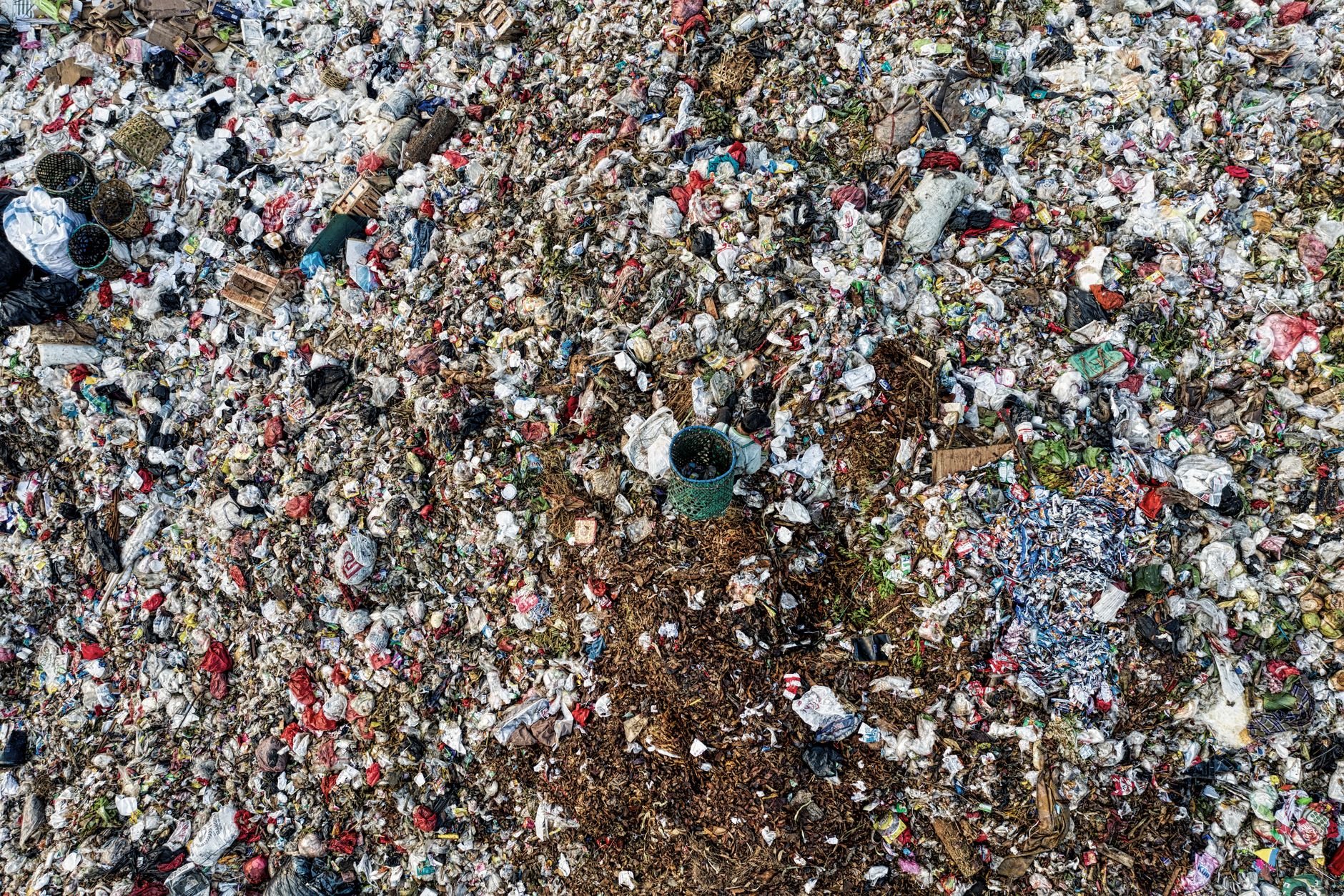 Aerial shot showing extensive environmental pollution at a landfill site.