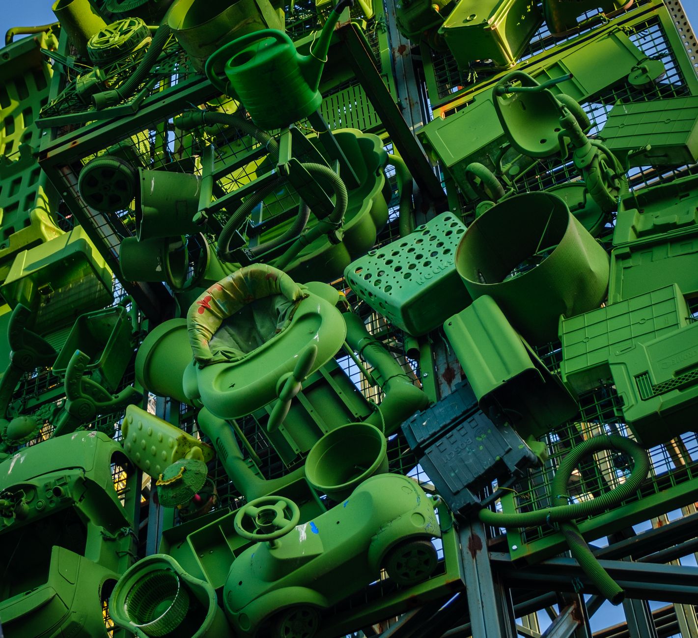 A vibrant art installation made from recycled green plastic materials, showcasing creative recycling.
