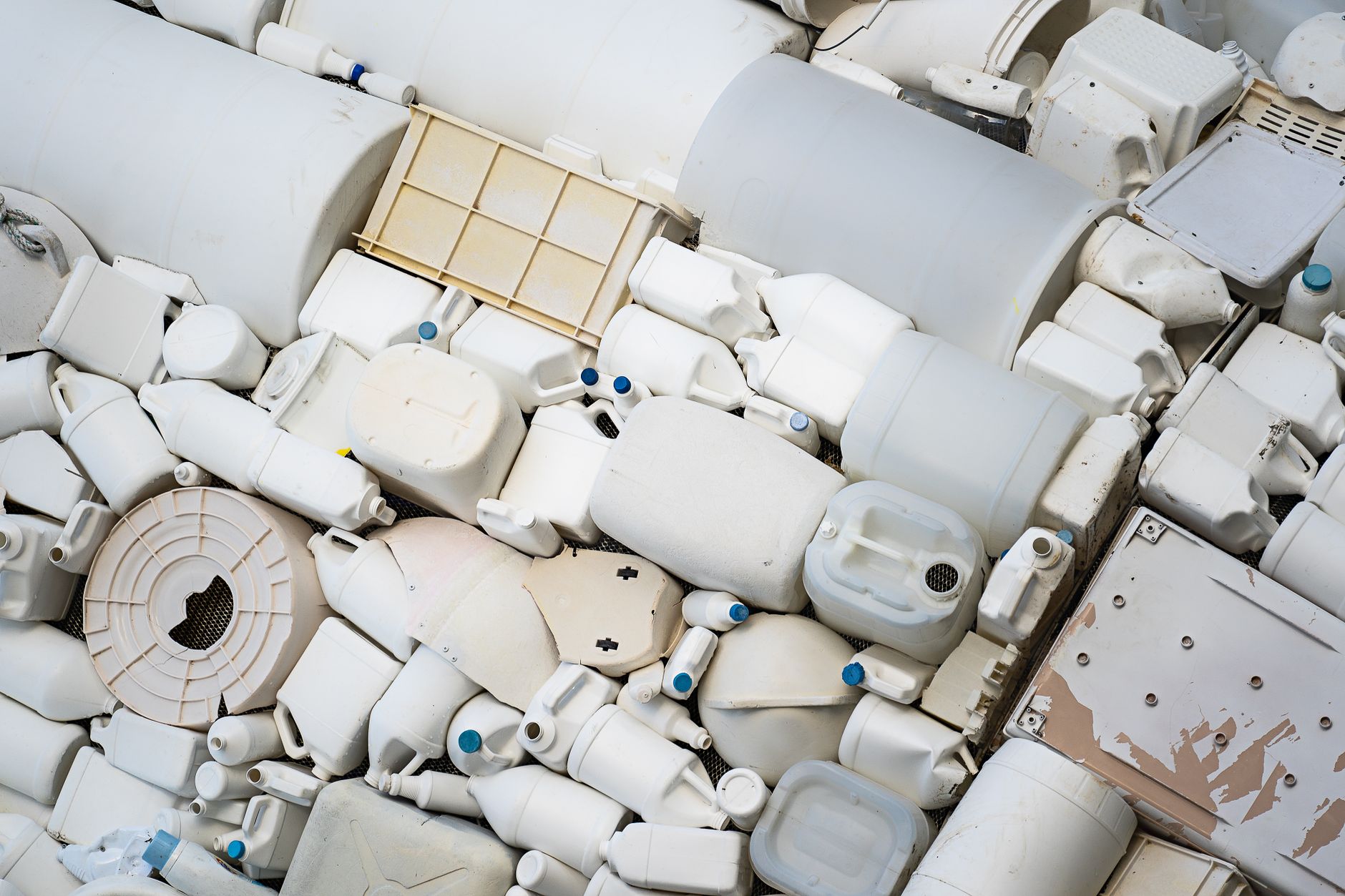 A pile of assorted recyclable plastic containers highlighting the issue of plastic waste.