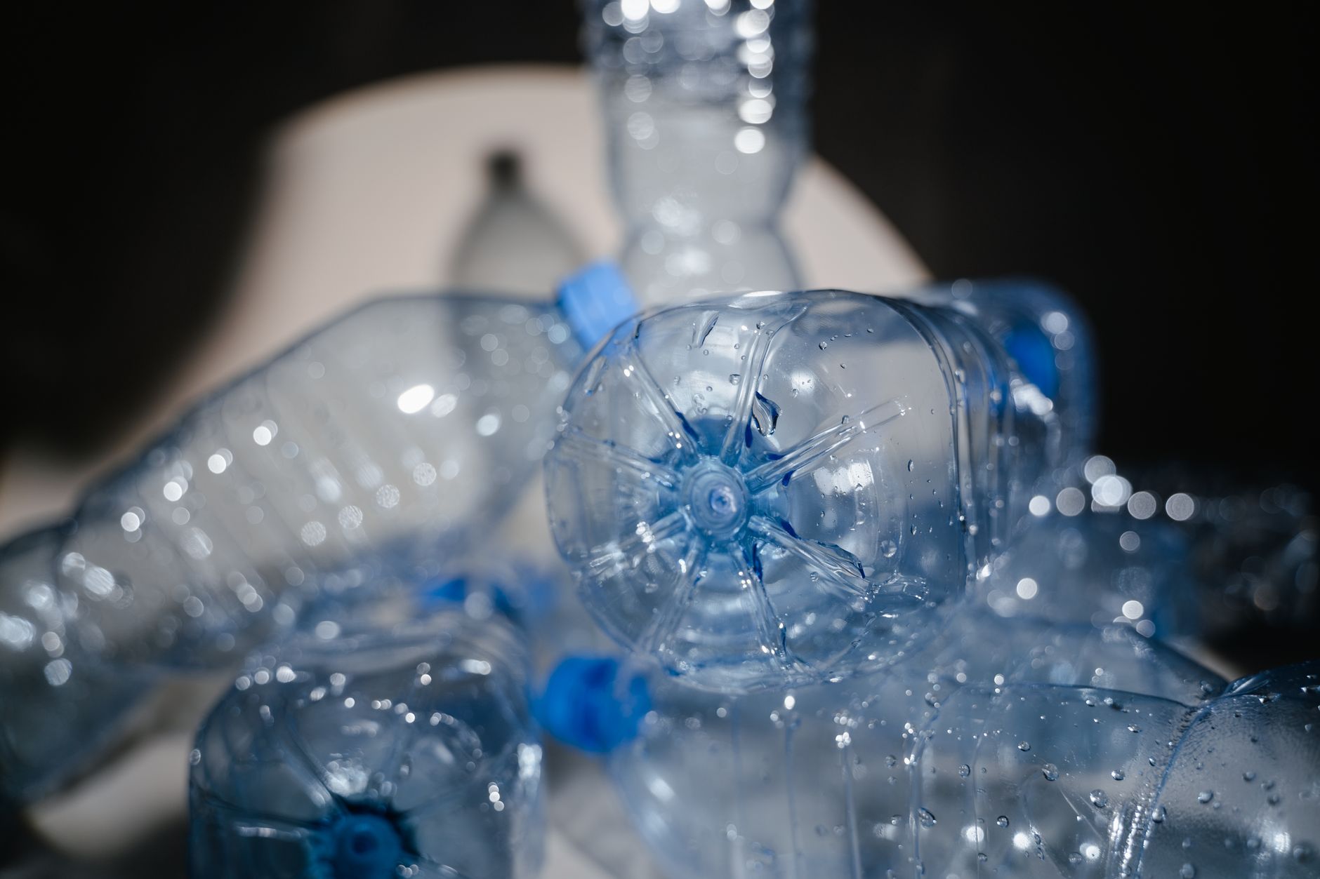 Detailed close-up of used plastic bottles ready for recycling, highlighting environmental impact.
