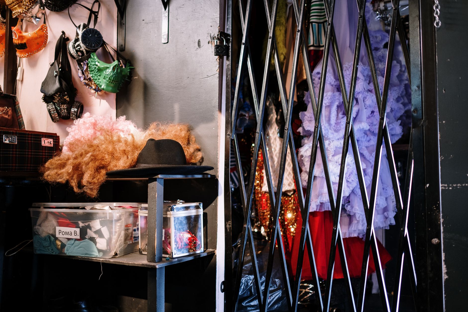 A vibrant dressing room filled with various costumes, hats, and wigs. Perfect for theater or fashion themes.